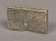 A late 19th century Continental unmarked silver filigree purse Of rounded rectangular hinged