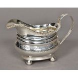 A George III silver cream jug, hallmarked London 1817,