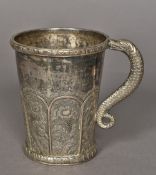 A 19th century Indian silver plate tankard With embossed floral decoration and scrolling serpent