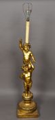 A 19th century carved giltwood standard lamp The column formed as two putto,