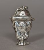 A 19th century silver box and cover, possibly Hanau The hinged cover surmounted with a putto,