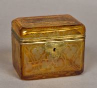 A 19th century Bohemian etched amber overlay glass casket The hinged lid decorated with a castle