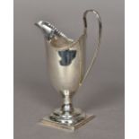 A George III silver cream jug, hallmarked London 1788,
