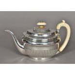 A George III silver teapot, hallmarked London 1806,
