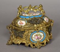 A Continental gilt metal and Sevres style porcelain inset casket Scroll cast and mounted with