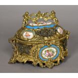 A Continental gilt metal and Sevres style porcelain inset casket Scroll cast and mounted with