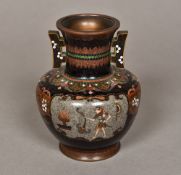 A late 19th/early 20th century cloisonne vase Of flared squat bulbous form with twin angular