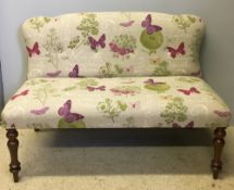 A Victorian upholstered window seat The overstuffed shaped back above the overstuffed seat,