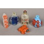 A Chinese carved hardstone snuff bottle and stopper Modelled as a toad; together with another,