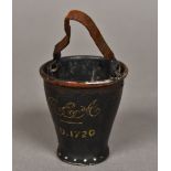 A Victorian table vesta for The Royal Exchange Assurance Company Formed as a fire bucket,