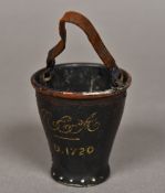 A Victorian table vesta for The Royal Exchange Assurance Company Formed as a fire bucket,