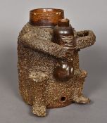 An 18th century Nottingham brown salt glaze stoneware bear jug Typically modelled,