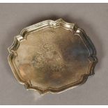 A George II silver waiter, hallmarked London 1730, makers mark indistinct With pie-crust rim,