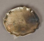 A George II silver waiter, hallmarked London 1730, makers mark indistinct With pie-crust rim,