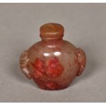 Two Chinese carved hardstone snuff bottles and stoppers The largest 7 cm high.