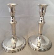 A pair of Danish Sterling silver candlesticks, hallmarked .830 purity and three tower mark Loaded.