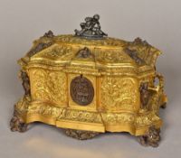 A 19th century Continental polished steel mounted gilt bronze casket The shaped hinged lid