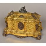 A 19th century Continental polished steel mounted gilt bronze casket The shaped hinged lid