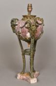 A bronze mounted marble table lamp Of urn form with three goat's mask headed monopodic legs,