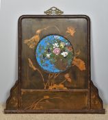 A late 19th century Chinese cloisonne centred lacquered screen With pierced brass handle above the