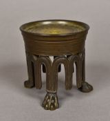 A 19th century Grand Tour patinated bronze stand Of circular form, standing on lions paw feet.