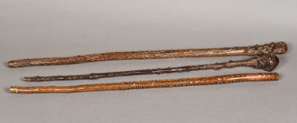 Three 19th century root wood walking sticks, possibly Japanese The largest 92 cm long.