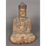 A Chinese Tang style carved wood Buddha Typically modelled with polychrome decoration. 33 cm high.