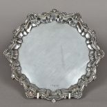 A Victorian silver salver, hallmarked for Sheffield 1898, maker's mark of HA Of dished shaped form,