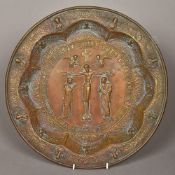 A Russian pressed metal platter Centred with the figure of Christ within cyrillic text and figural