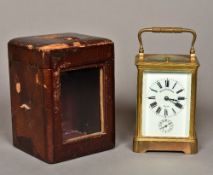 A brass cased repeating carriage alarm clock The white enamelled dial with Roman numerals and