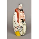 An Art Deco Limoges porcelain lamp Formed as a cloaked bearded figure and a semi-nude lady holding
