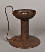 A late 19th century Arts & Crafts wrought iron chamber stick With deep bowled drip-pan and loop