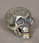 A white metal cased memento mori Masonic timepiece The case formed as a skull enclosing a white