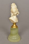 A late 19th/early 20th century carved ivory figural bust Modelled as a young lady with flowers in