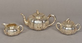 A 19th century Chinese three piece silver tea set,
