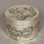 A late 19th century Chinese silver lidded box, maker's mark of LH Of cylindrical form,