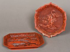 Two Chinese red cinnabar lacquer trays One worked with the figure of Guanyin riding a dragon,