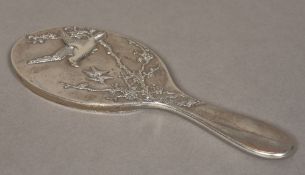 A Chinese silver cased hand mirror, hallmarked for Luen Hing,