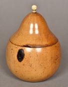 A fruitwood tea caddy modelled as a pear The hinged lid with a turned bone mounted finial. 14.