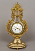 A gilt bronze and paste mounted mystery clock Surmounted with a female mask before a sunburst over