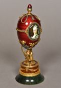 A diamond set gold mounted and enamel decorated egg,