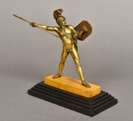 A Grand Tour gilt bronze model of a centurion Modelled nude bar a leaf and helmet, carrying a spear,