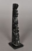 A Haida Queen Charlotte Island carved black stone totem pole Typically worked;