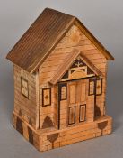 A specimen wood money box Worked as a cottage. 18.5 cm high.