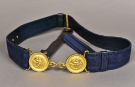 A French military belt Centred with a twin mask roundel ormolu buckle. The buckle 16 cm wide.