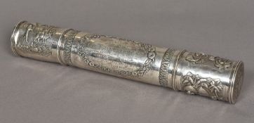 An Indian unmarked white metal scroll case The ends depicting rural scenes,