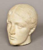 An antique carved marble bust Worked as the head of a young woman. 21 cm high.