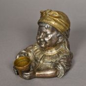 A Victorian silvered bronzed inkwell Formed as young girl holding a beaker. 12 cm high.