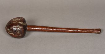 An antique tribal knobkerrie Of typical form, with bulbous knop, the shaft with suspension hole.