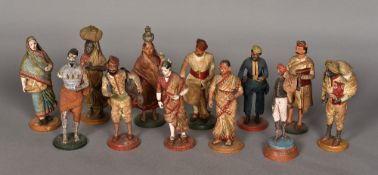 A collection of 19th century Indian plaster figures Each clothed and depicting a figure in various